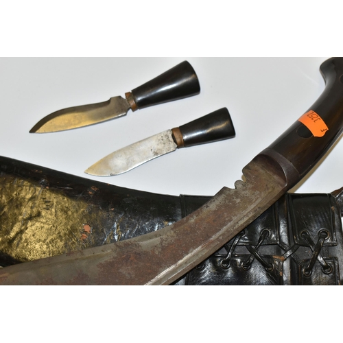 291 - A NEPALESE GURKHA KUKRI KNIFE, in its leather scabbard complete with its Kardar and Chakma knives