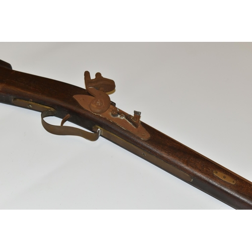 300 - A REPRODUCTION OF A FLINTLOCK RIFLE, lacks ram rod, non-firing, overall length 134cm, rusted conditi... 