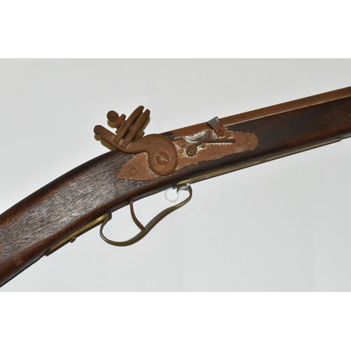 300 - A REPRODUCTION OF A FLINTLOCK RIFLE, lacks ram rod, non-firing, overall length 134cm, rusted conditi... 