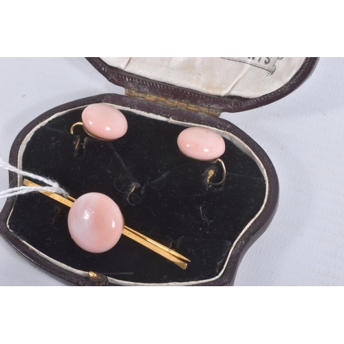 1 - A BAR BROOCH AND MATCHING EARRINGS, the yellow metal brooch set with a pink glass cabochon, fitted w... 