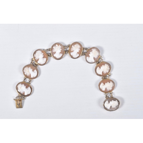 22 - A CAMEO LINE BRACELET, designed as a series of nine oval cameos, each collet set, fitted with an int... 