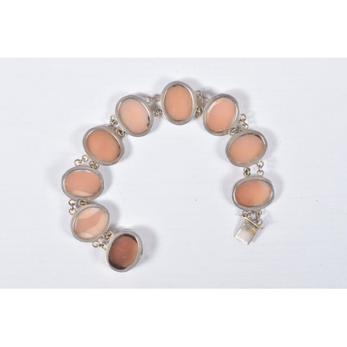 22 - A CAMEO LINE BRACELET, designed as a series of nine oval cameos, each collet set, fitted with an int... 