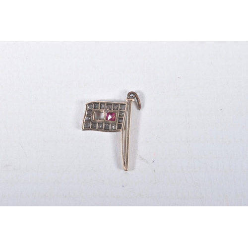 24 - FOUR MAINLY VICTORIAN CHARMS, to include a diamond and ruby set flag, set with a central square cut ... 