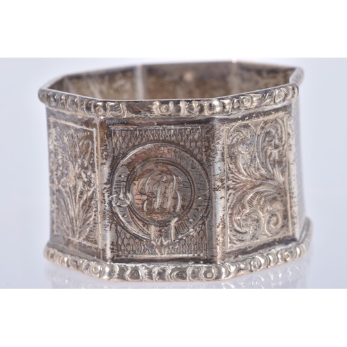 30 - A PAIR OF LATE VICTORIAN SILVER OCTAGONAL NAPKIN RINGS, alternate engine turned and engraved panels,... 