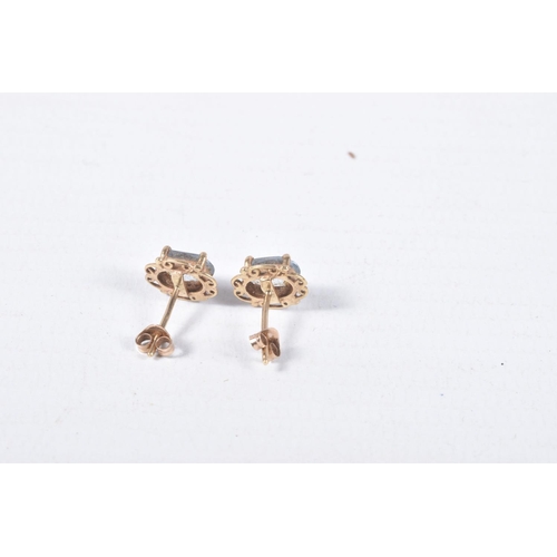 43 - TWO PAIRS OF EAR STUDS, the first designed as an oval blue topaz within a four claw setting with a s... 