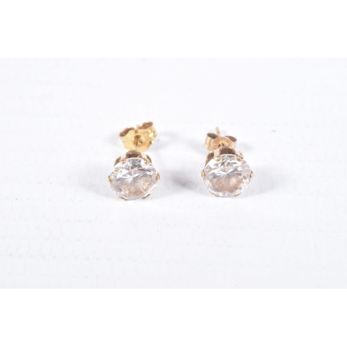 43 - TWO PAIRS OF EAR STUDS, the first designed as an oval blue topaz within a four claw setting with a s... 