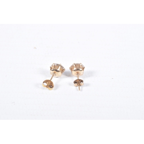 43 - TWO PAIRS OF EAR STUDS, the first designed as an oval blue topaz within a four claw setting with a s... 