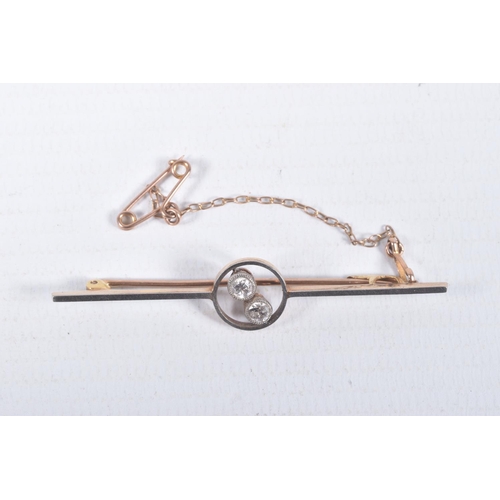 49 - A YELLOW METAL DIAMOND BAR BROOCH, polished bar with open work centre piece set with two old cut dia... 