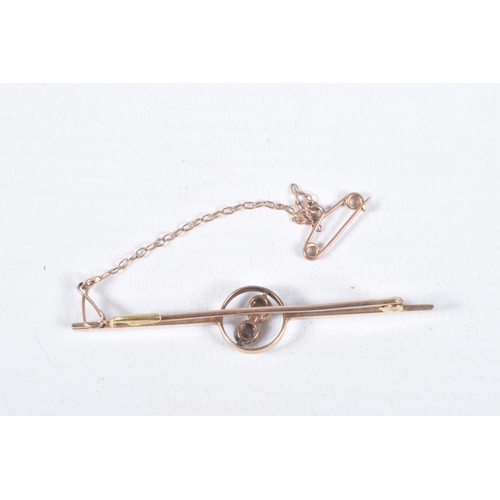 49 - A YELLOW METAL DIAMOND BAR BROOCH, polished bar with open work centre piece set with two old cut dia... 