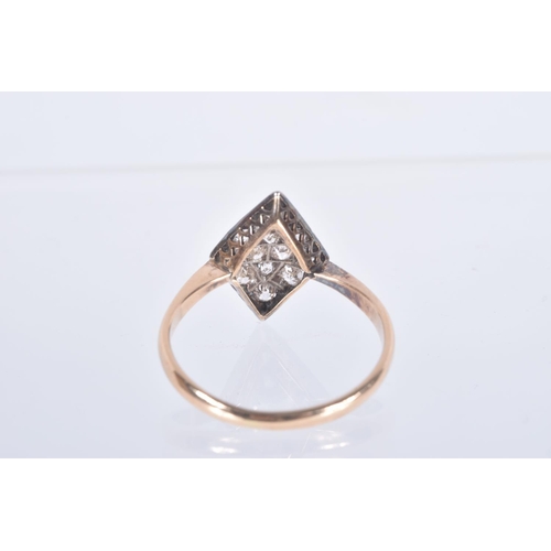 56 - A YELLOW METAL DIAMOND RING, rhombus shape set with eleven old cut diamonds and one round brilliant ... 