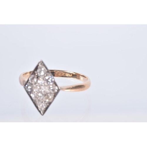 56 - A YELLOW METAL DIAMOND RING, rhombus shape set with eleven old cut diamonds and one round brilliant ... 