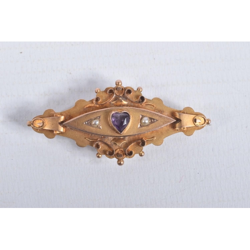 57 - AN EARLY 20TH CENTURY 9CT GOLD GEM SET BROOCH, set with a central heart cut amethyst, flanked with s... 