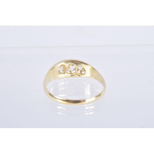 58 - A YELLOW METAL THREE STONE DIAMOND RING, set with three old cut diamonds, estimated total diamond we... 