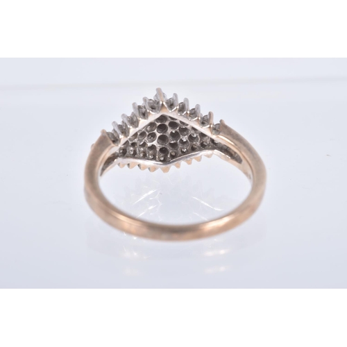 60 - A DIAMOND CLUSTER RING, forty nine single cut diamonds, prong set in white metal, leading on to a ye... 