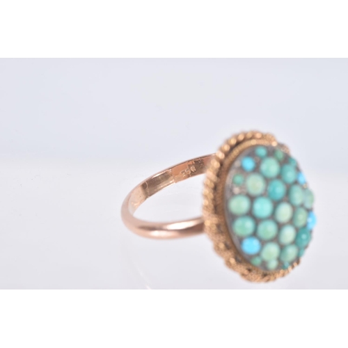 62 - A TURQUOISE RING, the oval panel set with circular turquoise cabochons, some replacements, to the ro... 