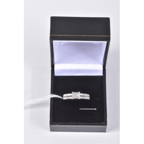 73 - A 9CT WHITE GOLD DIAMOND RING, four princess cut diamonds in an invisible setting leading on to spli... 