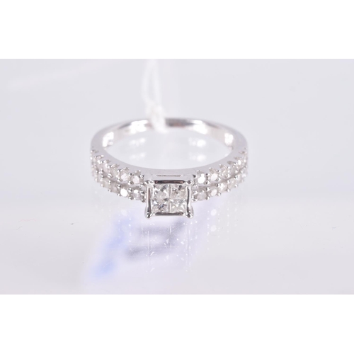 73 - A 9CT WHITE GOLD DIAMOND RING, four princess cut diamonds in an invisible setting leading on to spli... 