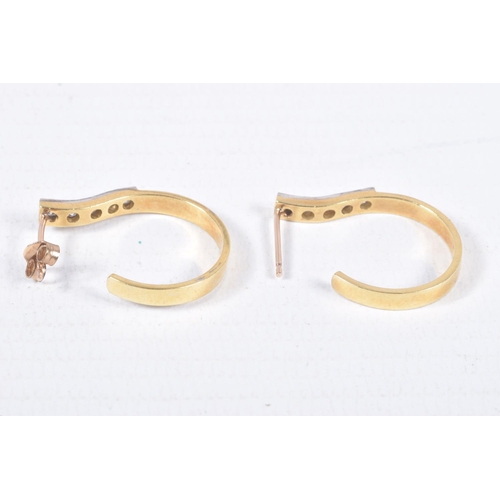 74 - A PAIR OF YELLOW METAL AND DIAMOND HOOP EARRINGS, five round brilliant cut diamonds, grain set in wh... 