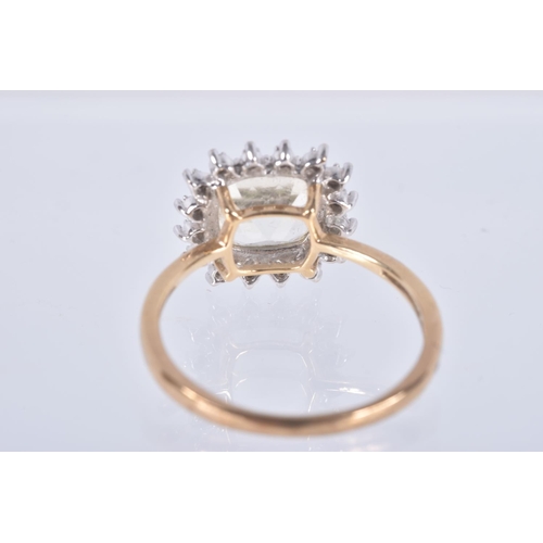 77 - A 9CT GOLD GEM SET RING, a square cut light yellow quartz, set with a halo of single cut diamonds, h... 