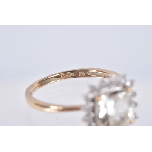 77 - A 9CT GOLD GEM SET RING, a square cut light yellow quartz, set with a halo of single cut diamonds, h... 