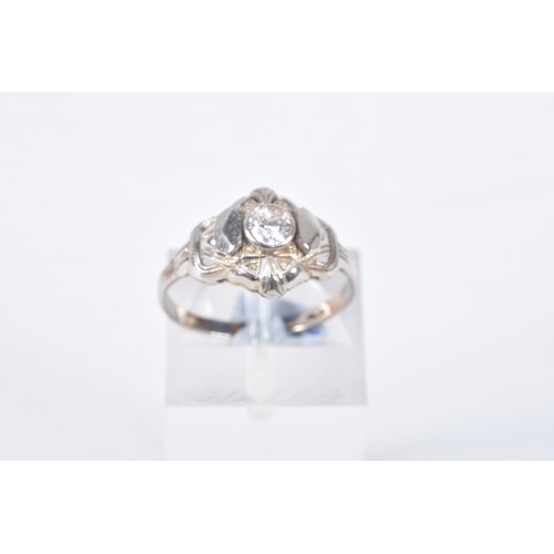 83 - A SINGLE STONE DIAMOND RING, designed as a central old cut diamond within a pierced geometric style ... 