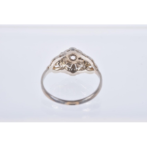 83 - A SINGLE STONE DIAMOND RING, designed as a central old cut diamond within a pierced geometric style ... 