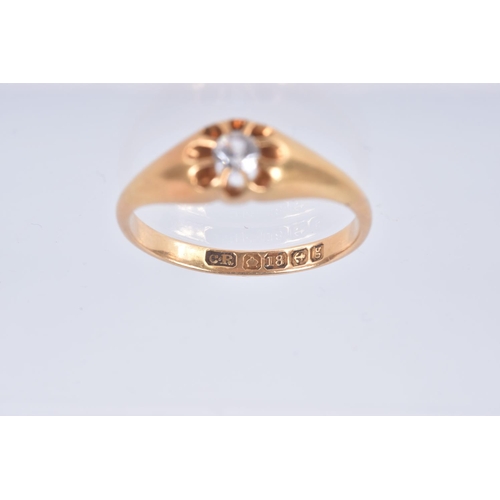 85 - AN EARLY 20TH CENTURY, 18CT GOLD RING, centring on a circular cut colourless stone, assessed as spin... 