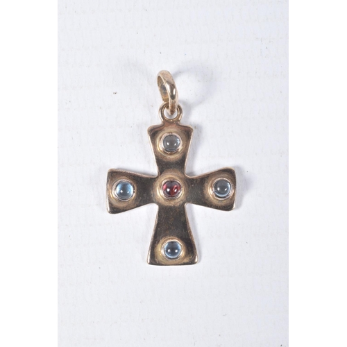 88 - A YELLOW METAL CROSS PENDANT, polished cross set with a central garnet cabochon and four blue topaz ... 