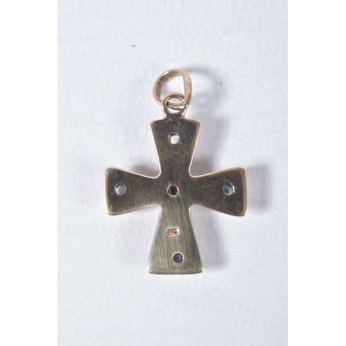 88 - A YELLOW METAL CROSS PENDANT, polished cross set with a central garnet cabochon and four blue topaz ... 