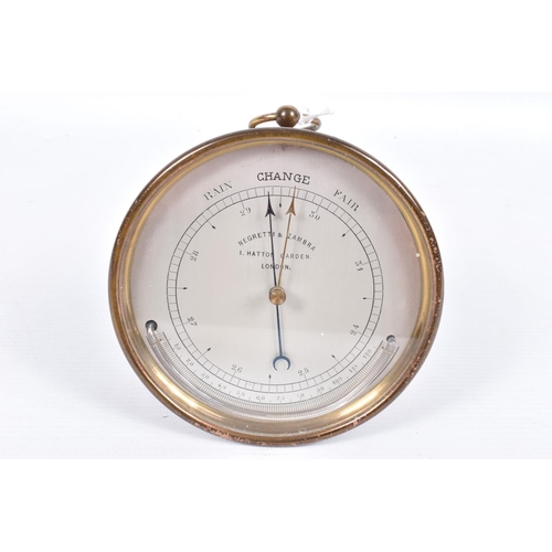 106 - A NEGRETTI & ZAMBRA BRASS CASED CIRCULAR BAROMETER, the silvered dial marked with 'RAIN CHANGE FAIR'... 