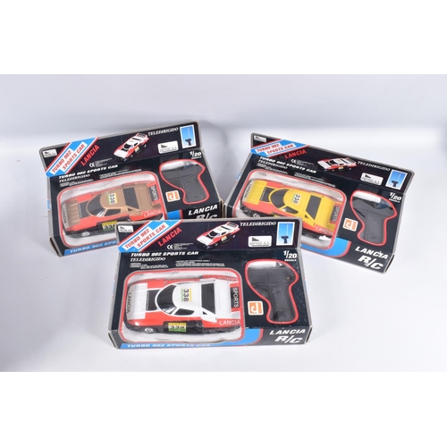 136 - A COLLECTION OF BOXED PLASTIC LANCIA CAR MODELS, including battery operated friction drive by Hong D... 