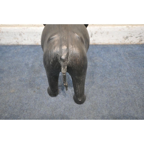 1201 - IN THE MANNER OF LIBERTY OF LONDON, A SMALL LEATHER FIGURE OF A BELLOWING ELEPHANT, height 48cm (con... 