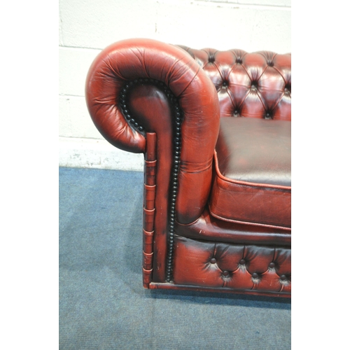 1204 - AN OXBLOOD LEATHER CHESTERFIELD BUTTONED THREE SEATER SOFA, length 200cm x depth 90cm x height 68cm ... 