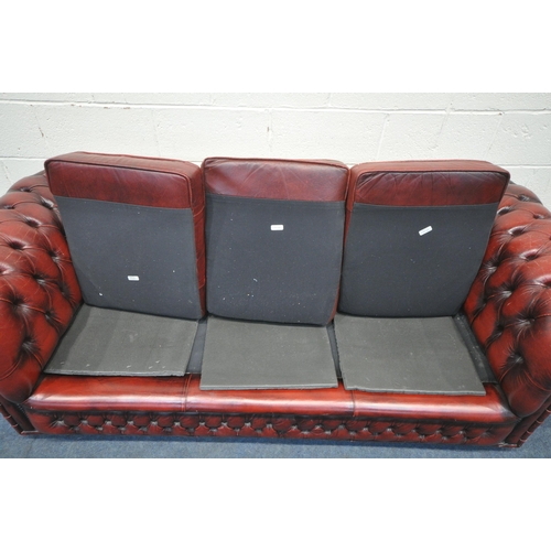 1204 - AN OXBLOOD LEATHER CHESTERFIELD BUTTONED THREE SEATER SOFA, length 200cm x depth 90cm x height 68cm ... 