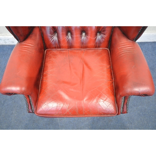 1206 - AN OXBLOOD LEATHER CHESTERFIELD WING BACK ARMCHAIR, on front cabriole legs, width 81cm x depth 84cm ... 