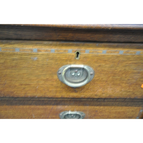 1215 - AN ARTS AND CRAFTS OAK CHEST OF TWO SHORT OVER TWO LONG DRAWERS, on tapered legs and square feet, wi... 