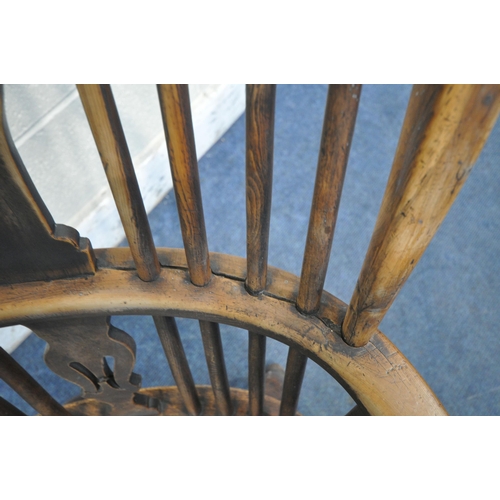 1217 - A 19TH CENTURY ELM AND BEECH WINDSOR ELBOW CHAIR, with spindle back and central splat, on turned sup... 