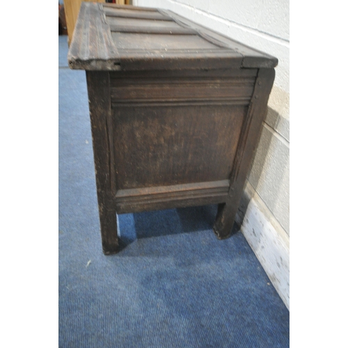 1218 - A GEORGIAN OAK COFFER, with a hinged lid, the front panels with scrolled and foliate carvings, width... 