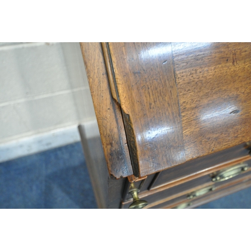 1219 - A GEORGIAN MAHOGANY BUREAU, the fall front door enclosing a fitted interior, above four drawers, on ... 