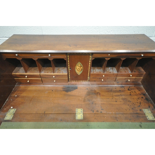 1219 - A GEORGIAN MAHOGANY BUREAU, the fall front door enclosing a fitted interior, above four drawers, on ... 