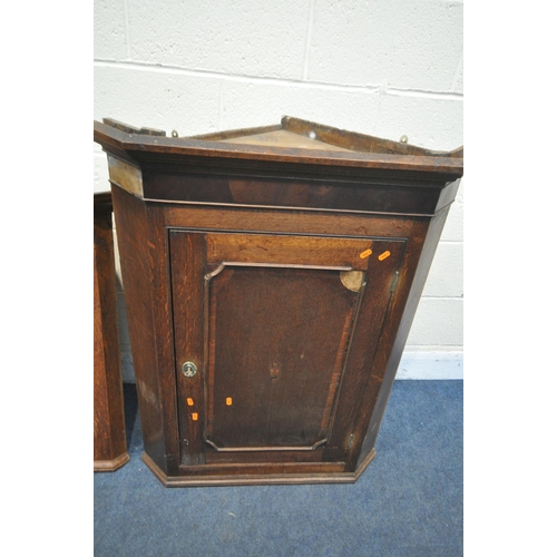 1227 - THREE PIECES OF GEORGIAN OAK FURNITURE, to include a corner cupboard, the single door enclosing thre... 