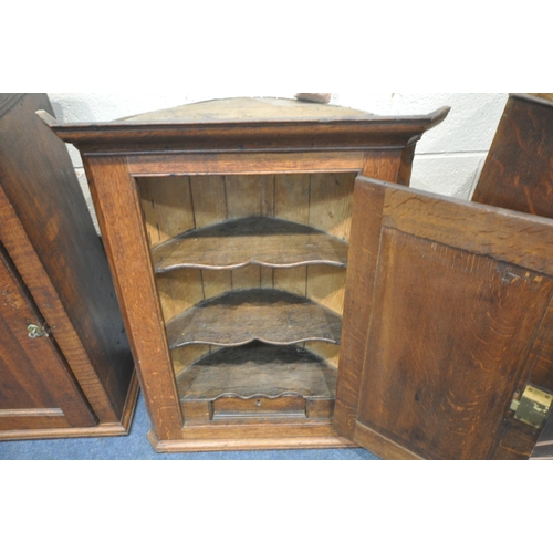 1227 - THREE PIECES OF GEORGIAN OAK FURNITURE, to include a corner cupboard, the single door enclosing thre... 