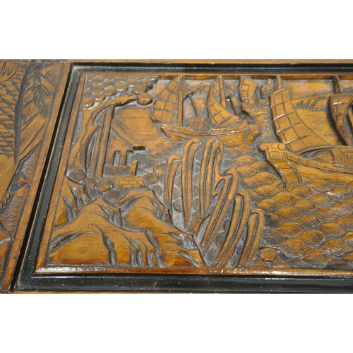 1228 - A 20TH CENTURY CAMPHORWOOD BLANKET CHEST, with detailed carving depicting ships, mountains, fish, et... 