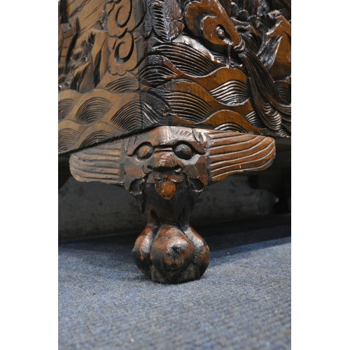 1228 - A 20TH CENTURY CAMPHORWOOD BLANKET CHEST, with detailed carving depicting ships, mountains, fish, et... 