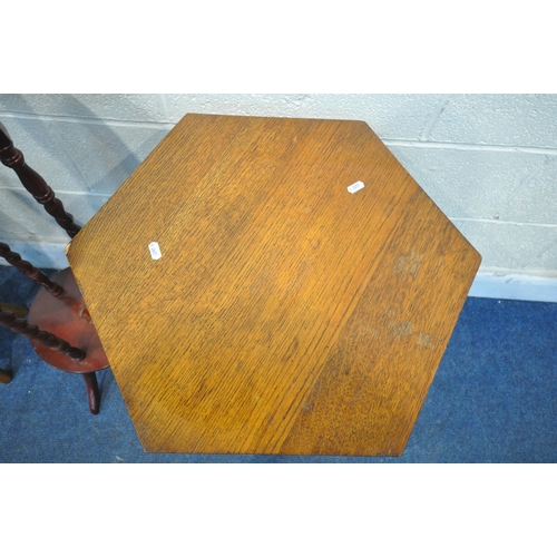 1233 - AN ARTS AND CRAFTS OAK HEXAGONAL OCCASIONAL TABLE, on turned legs and an undershelf, diameter 56cm x... 