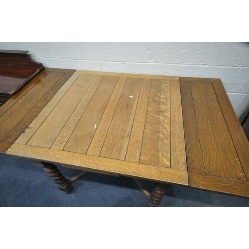 1237 - A 20TH CENTURY OAK DRAW LEAF DINING TABLE, on barley twist supports, united by a cross stretcher, op... 