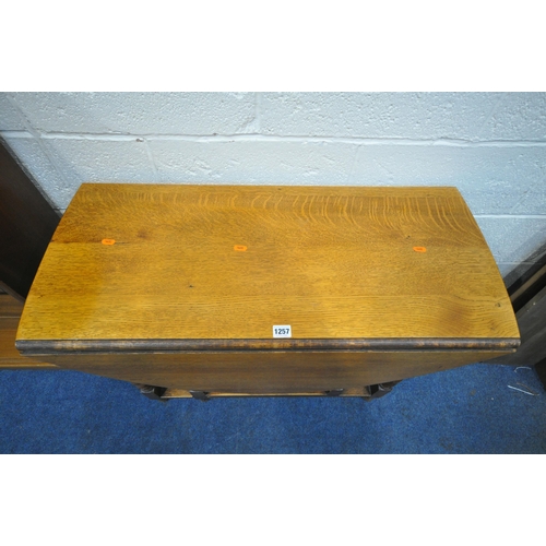 1257 - A 20TH CENTURY OAK BARLEY TWIST GATE LEG TABLE, an open bookcase and a mid-century teak corner cupbo... 