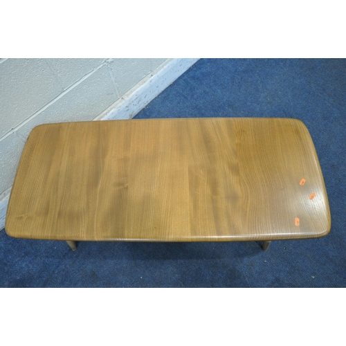 1260 - A MID CENTURY ERCOL ELM AND BEECH COFFEE TABLE, on turned legs and undershelf, length 106cm x depth ... 