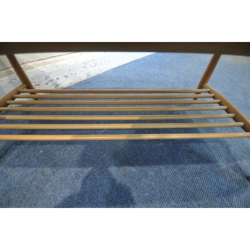 1260 - A MID CENTURY ERCOL ELM AND BEECH COFFEE TABLE, on turned legs and undershelf, length 106cm x depth ... 