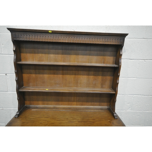 1264 - A DARK ERCOL DRESSER, the top two tier plate rack above two drawers and two cupboard doors, width 12... 